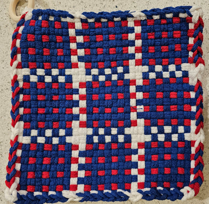 Woven potholder with a checkered pattern in red, white, and blue 