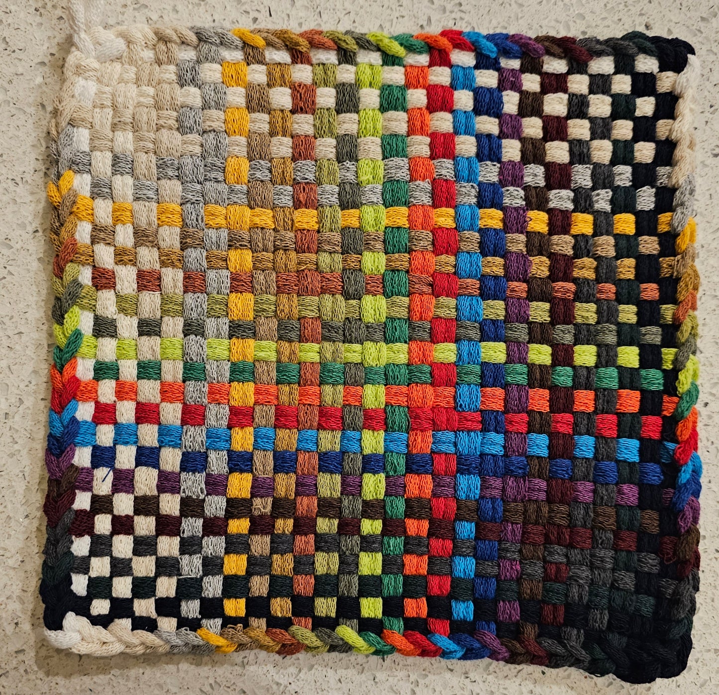 Multicolored potholder with a checkered pattern 