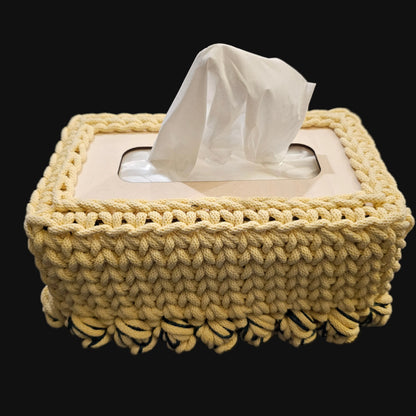 A light yellow crocheted tissue box cover with yellow and green tulips at the base.10x5x5 inches overall
