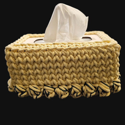 A light yellow crocheted tissue box cover with yellow and green tulips at the base.10x5x5 inches overall