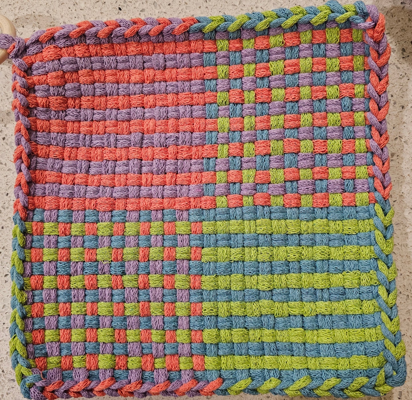 Potholder with a checkered pattern with lime lavender blue pink