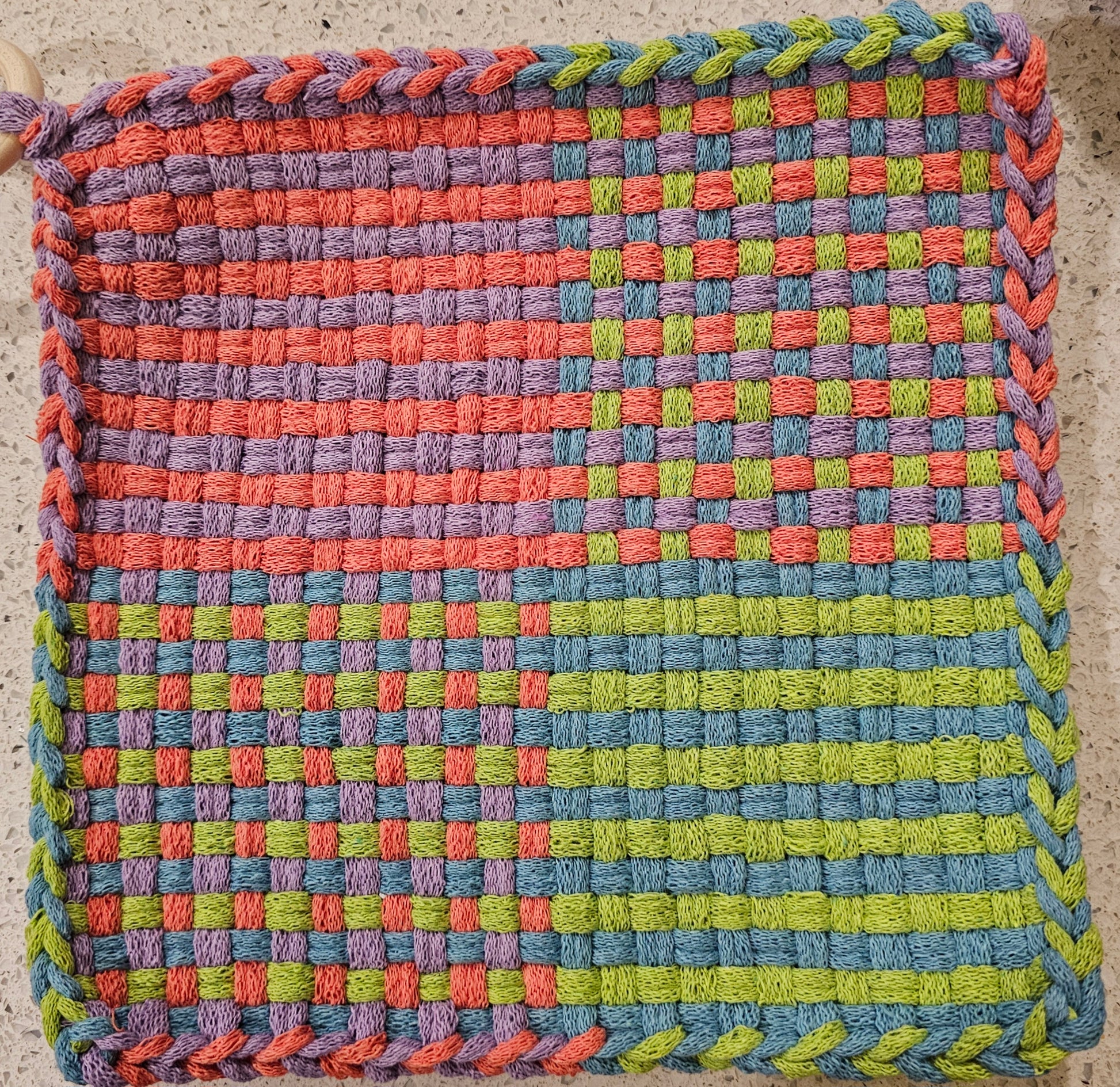 Potholder with a checkered pattern with lime lavender blue pink
