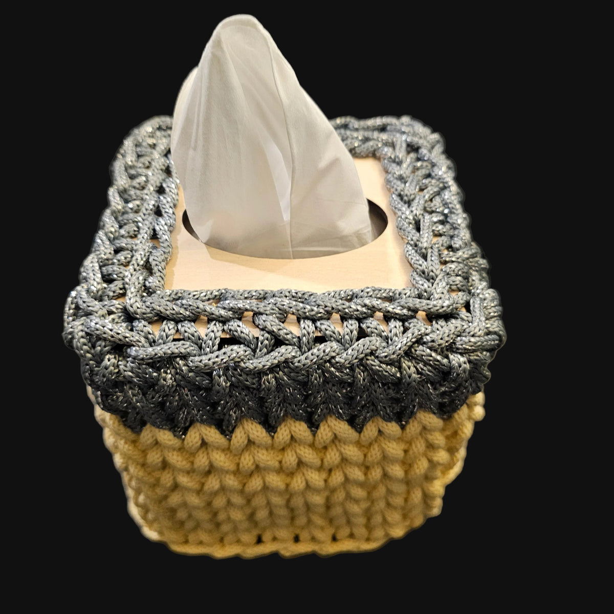 A crocheted tissue box cover in a two-tone design of metallic steel gray and light yellow. 5x5x6 inches overall