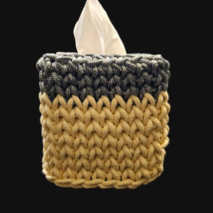 A crocheted tissue box cover in a two-tone design of metallic steel gray and light yellow. 5x5x6 inches overall
