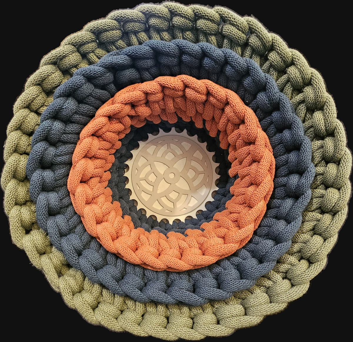 Three chunky crocheted storage baskets in concentric rings of olive green, slate blue, terracotta, and gray with a natural beige center Small 7x7x4; Medium 9x9x5; Large 12x12x6 overall (shown here nested together)