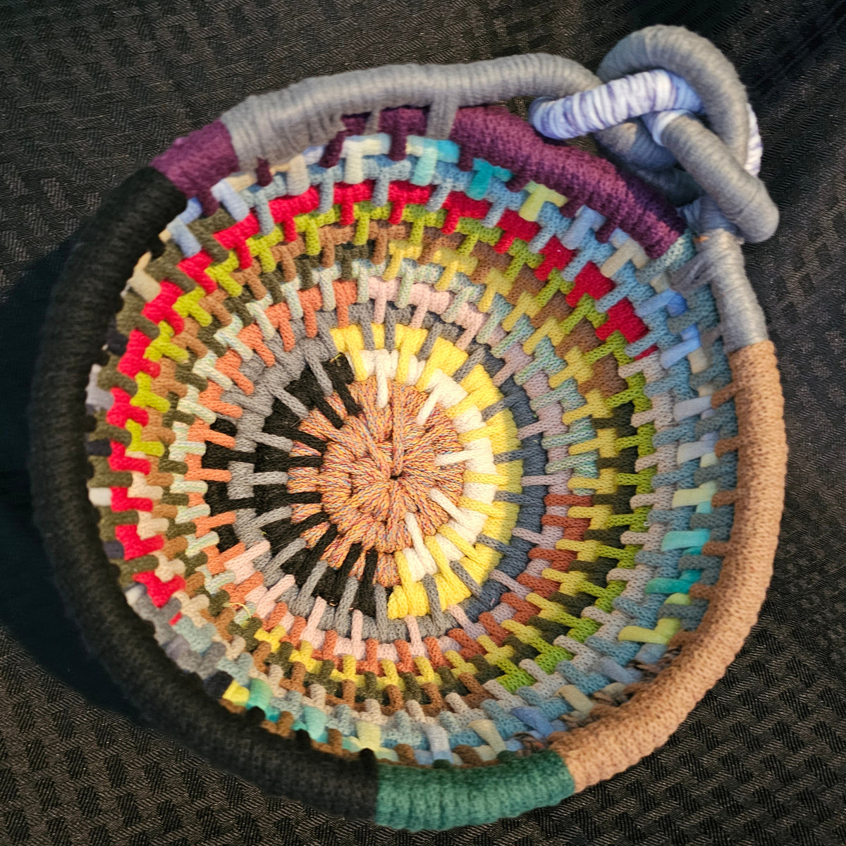 The ultimate basket formed from the leftover odds and ends from the other coiled baskets. This is that compilation of textures and colors made by hand with a story that matches.