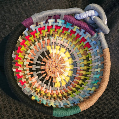 The ultimate basket formed from the leftover odds and ends from the other coiled baskets. This is that compilation of textures and colors made by hand with a story that matches.