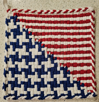 Woven potholder with a pattern resembling the American flag 