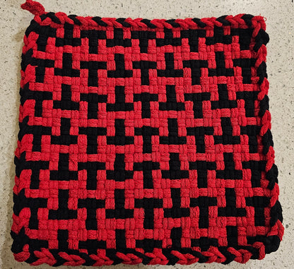 Red and black woven potholder in a "T" formation