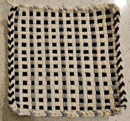 Woven black and white potholder