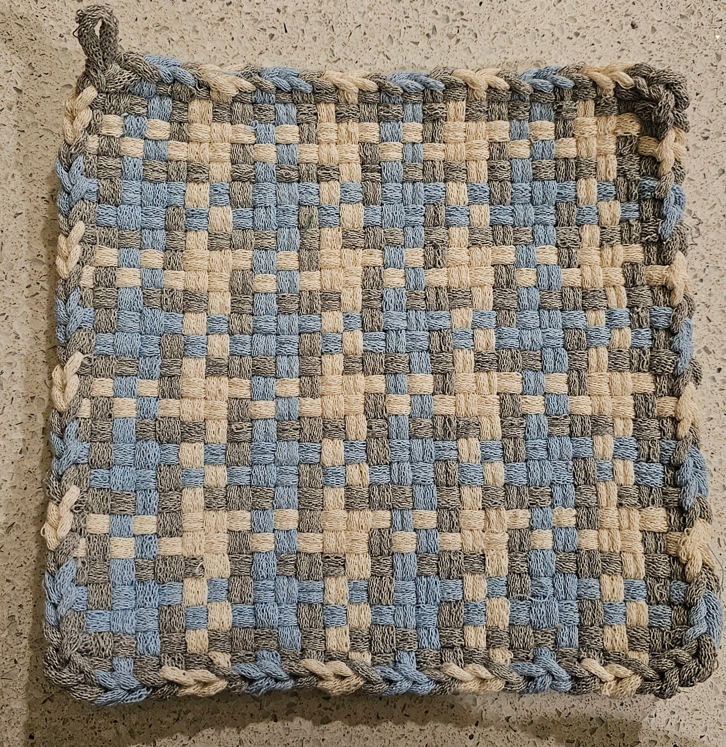 Woven potholder with powder blue, silver and winter white pattern 