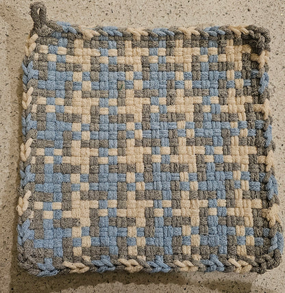 Woven potholder with powder blue, silver and winter white pattern 