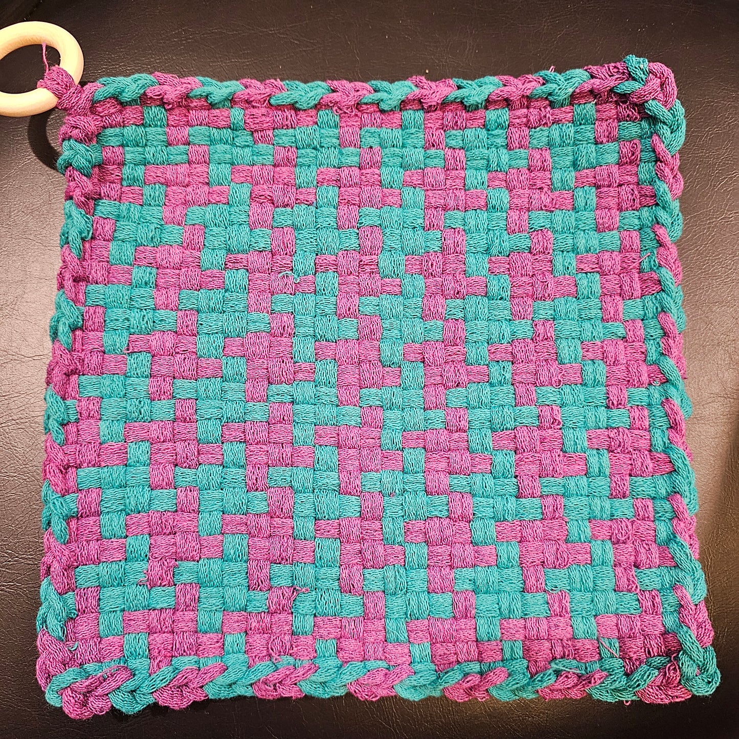Hand-woven pink and turquoise square 