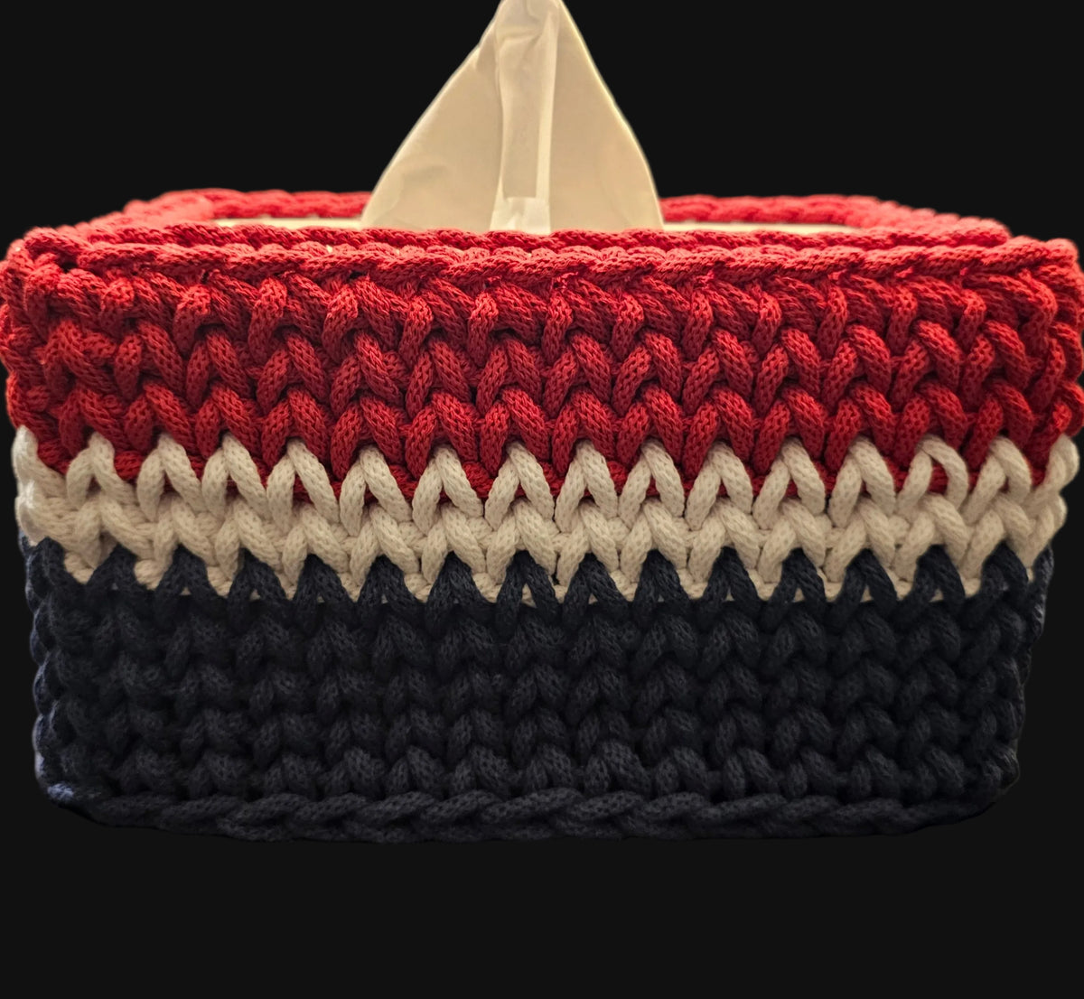 A rectangular crocheted tissue box cover in red, white, and blue stripes. 10x5x5 inches overall