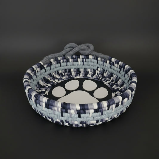 Extra-large coiled basket in shades of gray with a decorative looped handle