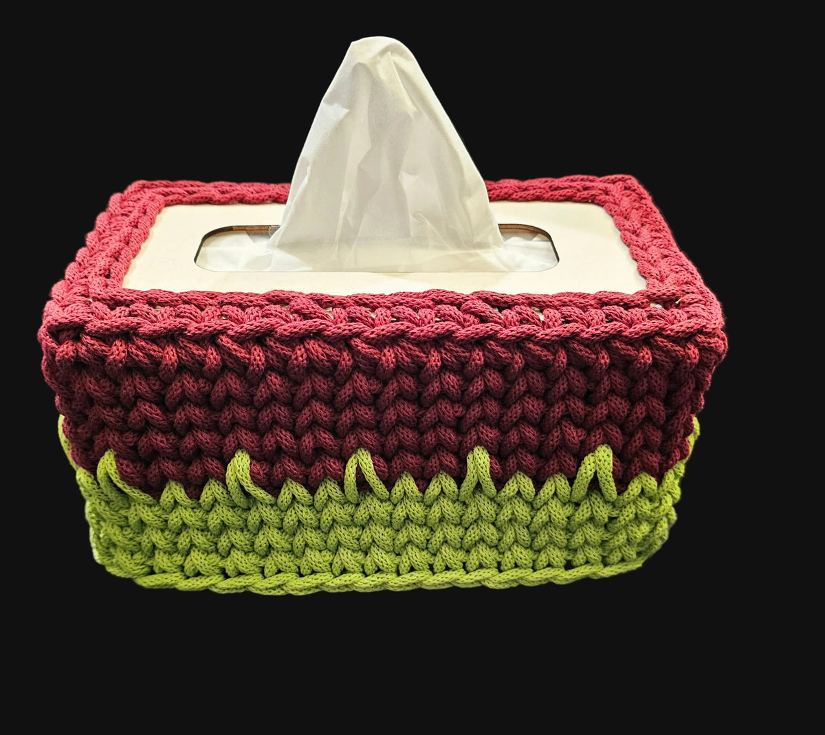 A handmade crocheted tissue box cover in two colors: a wine red top section and a lime green bottom section. 10x5x5 inches overall